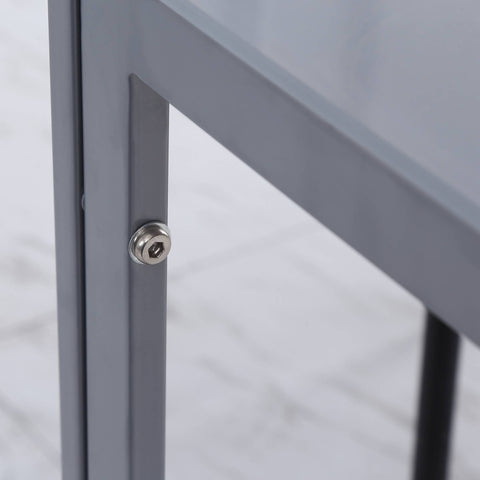 Silver hexagonal head screw securing gray powder coated steel frame of homcom modern dining table with tempered glass top