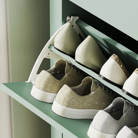 A sleek white plastic shoe cabinet with two flip drawers and a modern minimalist design for organized shoe storage
