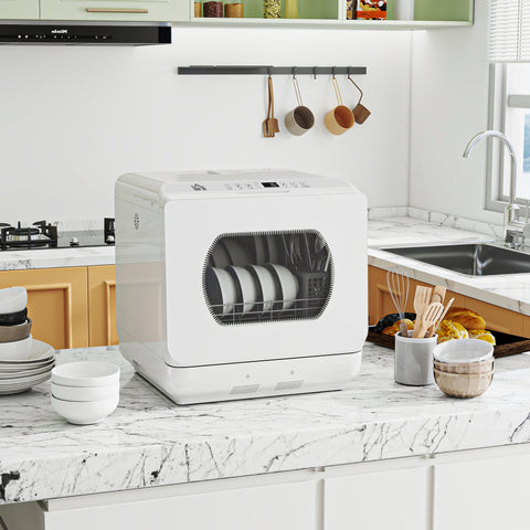 White tabletop dishwasher with transparent door showing stacked plates and bowl rack includes drain hose feature