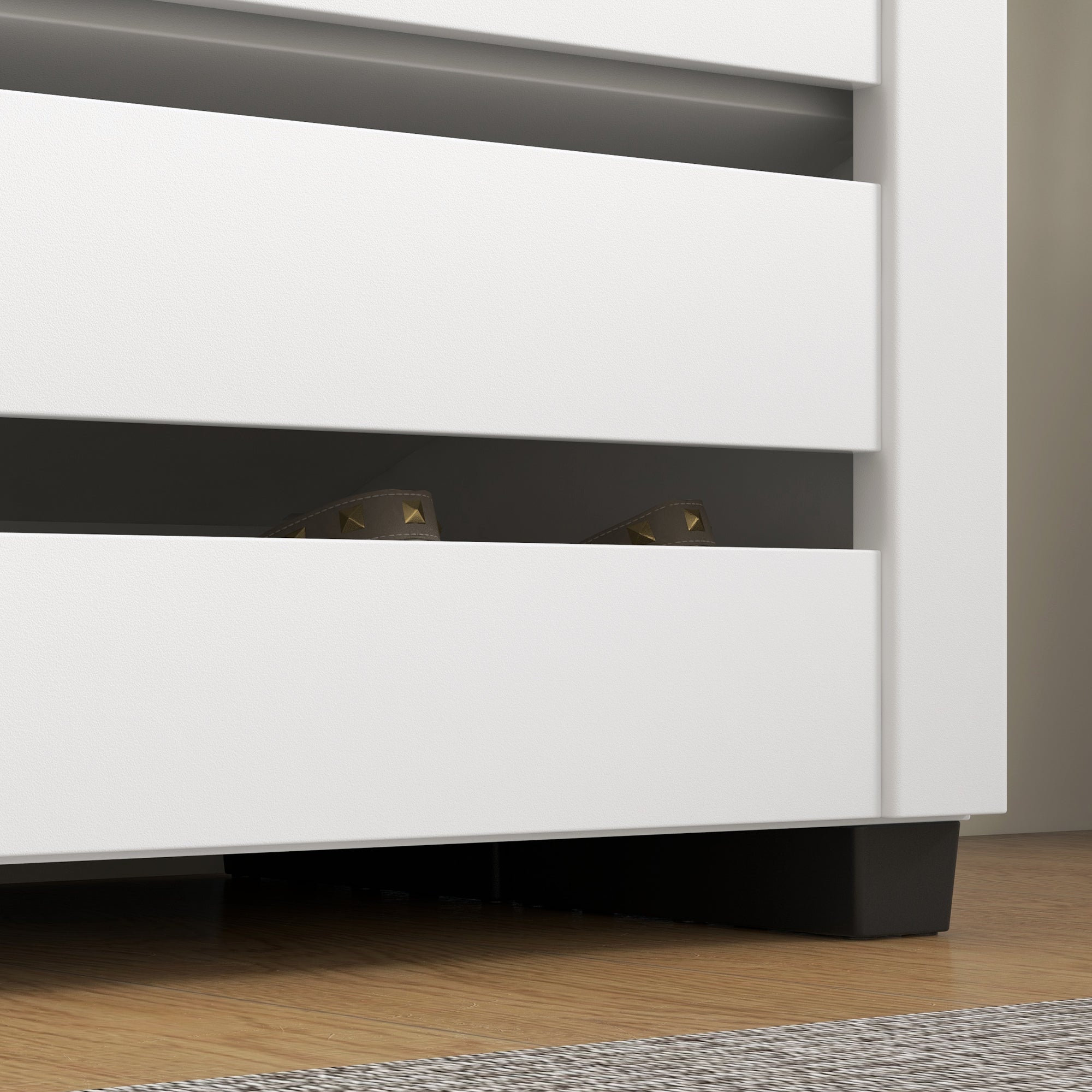White minimalist shoe cabinet with sleek drawers black accents slatted doors and adjustable shelves for shoe storage