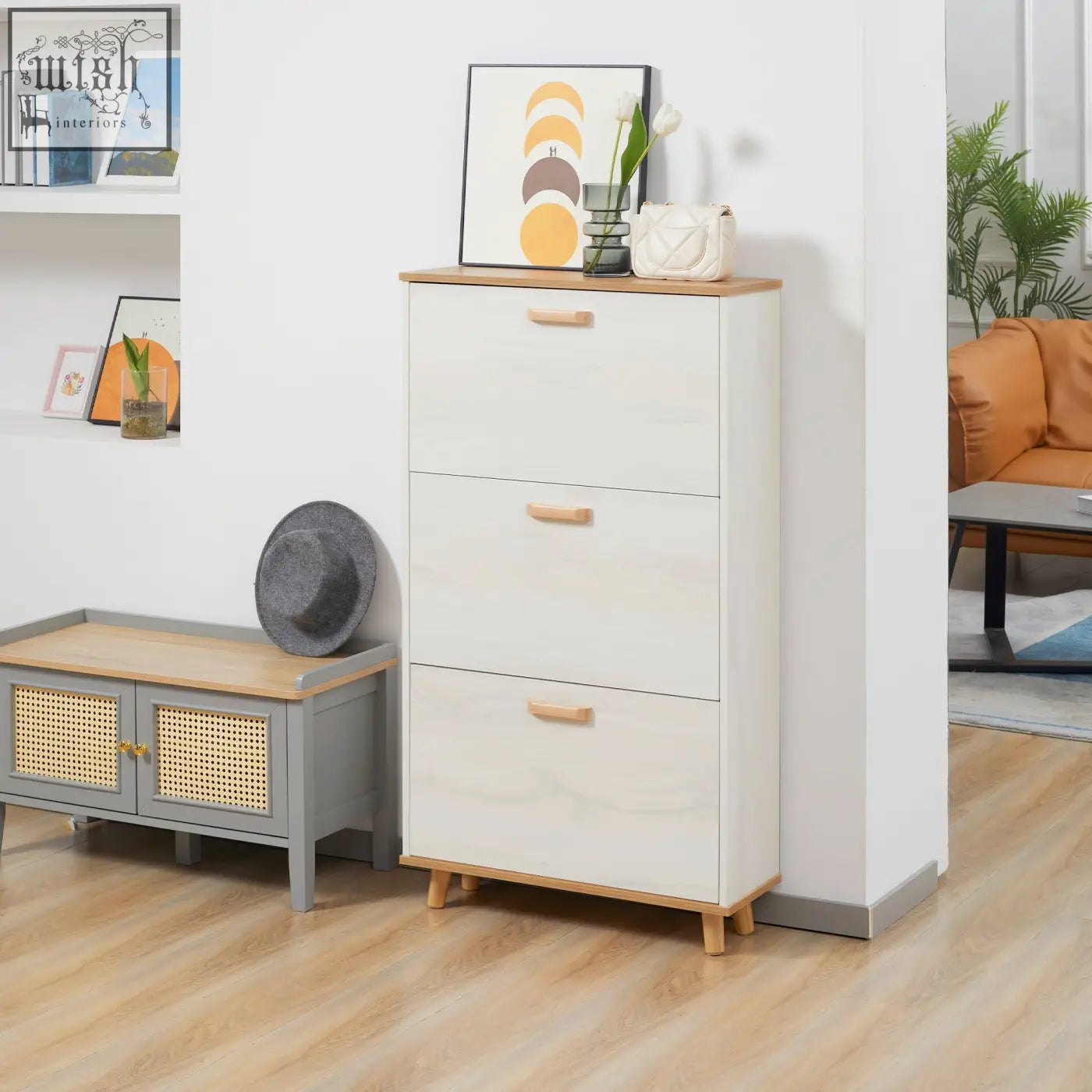 White three-drawer shoe storage cabinet with light wood accents made of particle board for hallway shoe storage