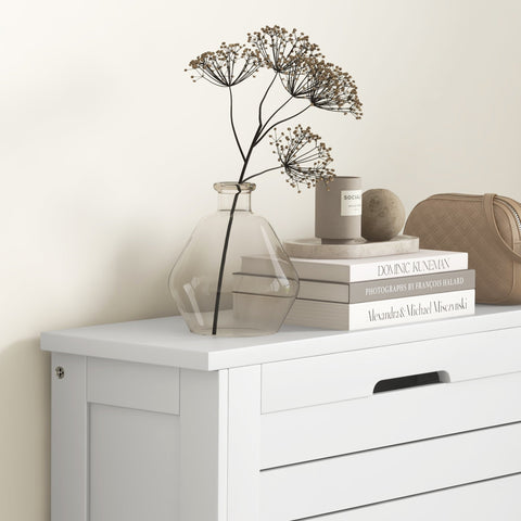 Homcom white narrow shoe storage cabinet with 3 flip drawers holding a clear glass vase with dried botanical stems