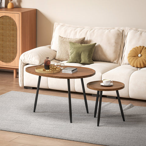 Two oval coffee tables with chestnut wood effect tops and sleek matte black metal legs for living room use