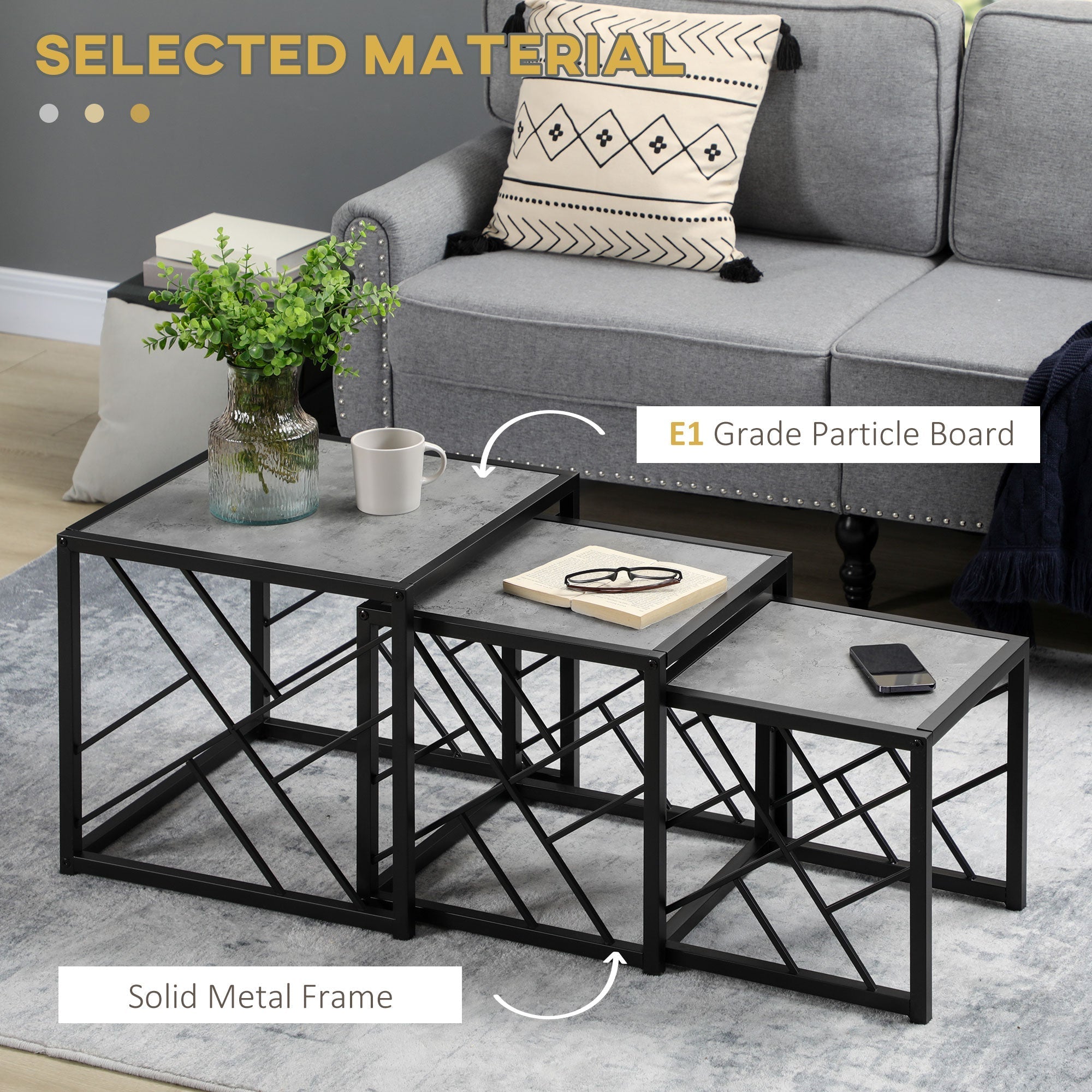 Set of three nesting coffee tables with black metal frame and grey concrete-style tops for living room use
