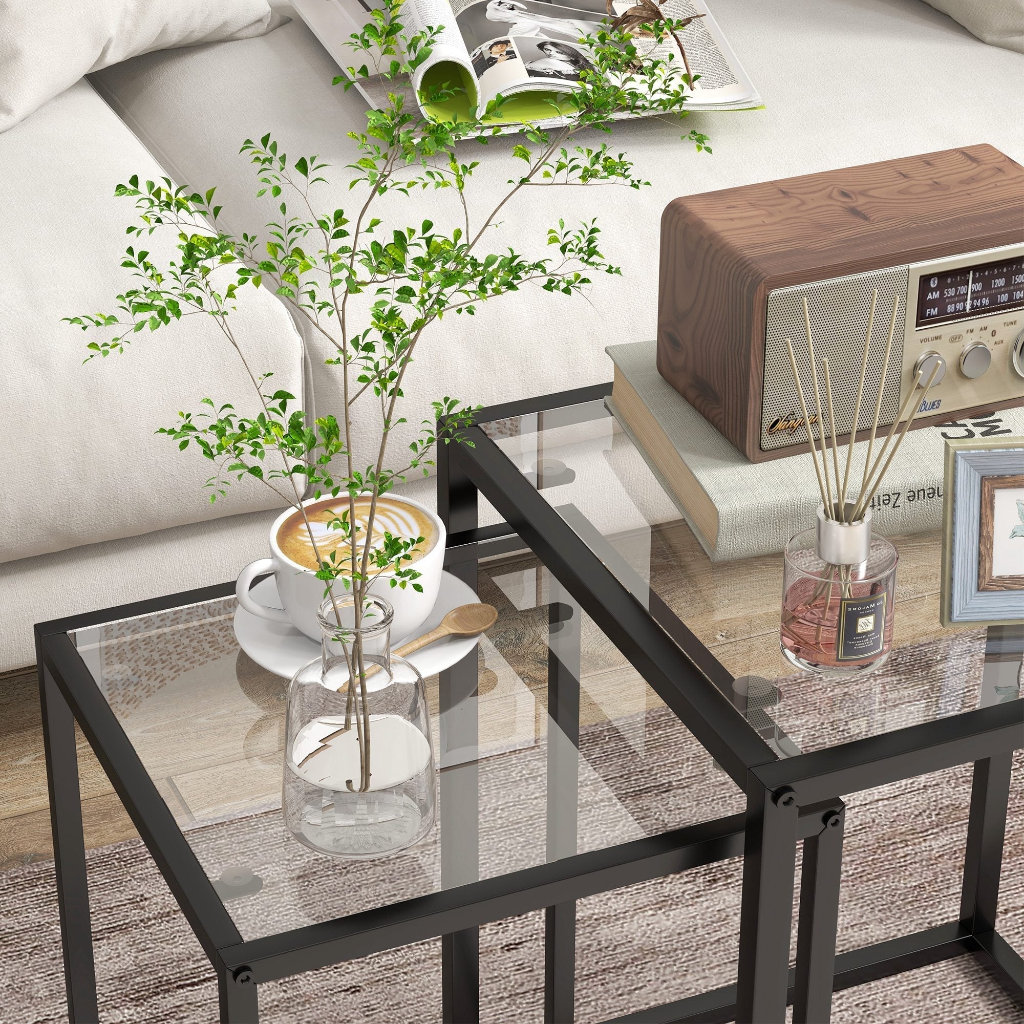 Black metal-framed nesting table set with tempered glass top perfect for living room or bedroom use
