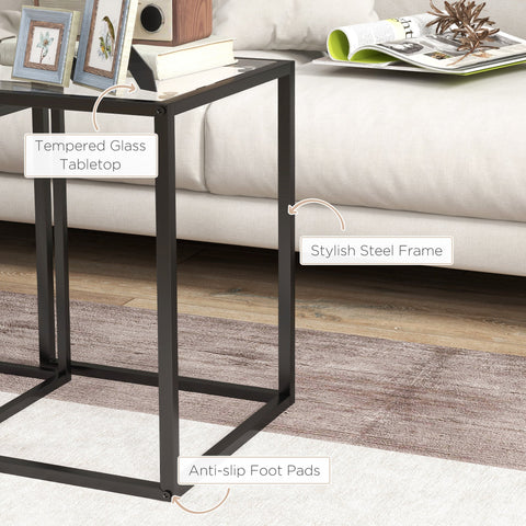 Black tempered glass tabletop supported by steel frame with anti slip pads in HOMCOM nesting table set for living room