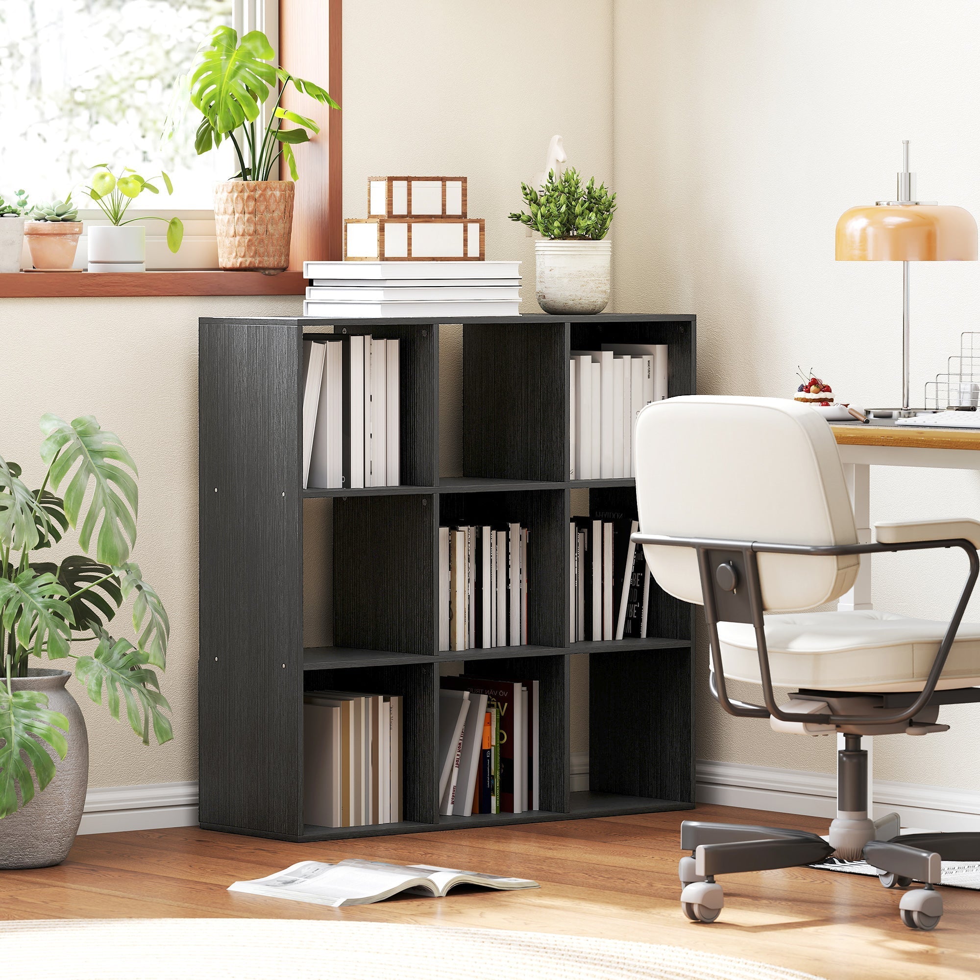 Black wood-grain particle board HOMCOM nine-cube storage shelf with nine open cubbies and books stacked on top