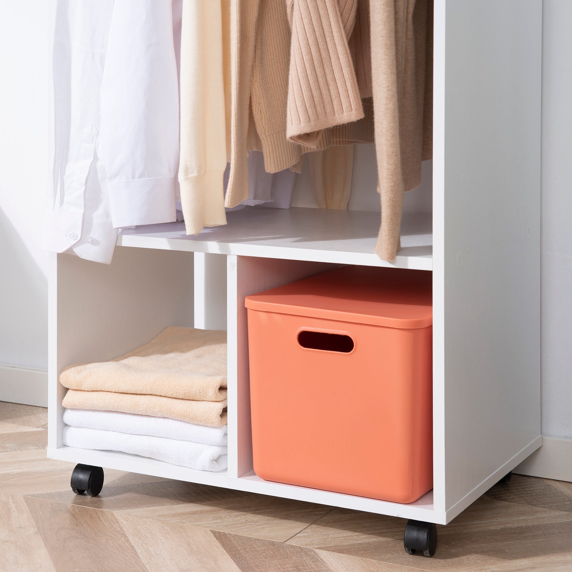 Orange plastic storage bin with rectangular handle inside homcom open wardrobe with aluminium hanging rail and particle board shelves