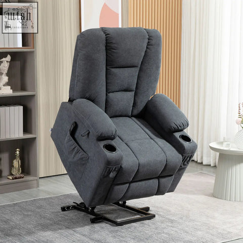 Dark gray plush recliner chair with cup holder and black metal base for standing position in charcoal grey fabric upholstery