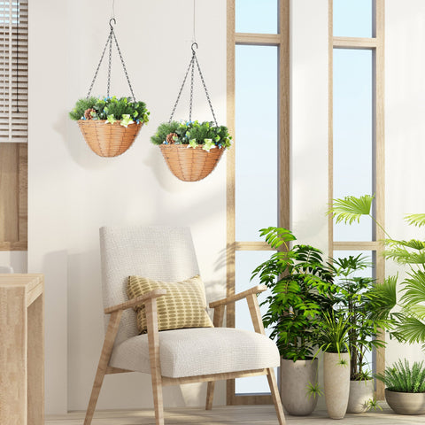 Woven wicker hanging plant baskets with chain suspension holding green artificial flowers for office decor