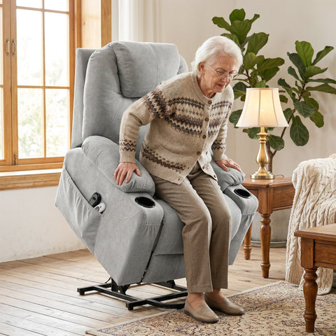 Gray upholstered power lift recliner chair with built-in cup holders and side pockets in light grey fabric