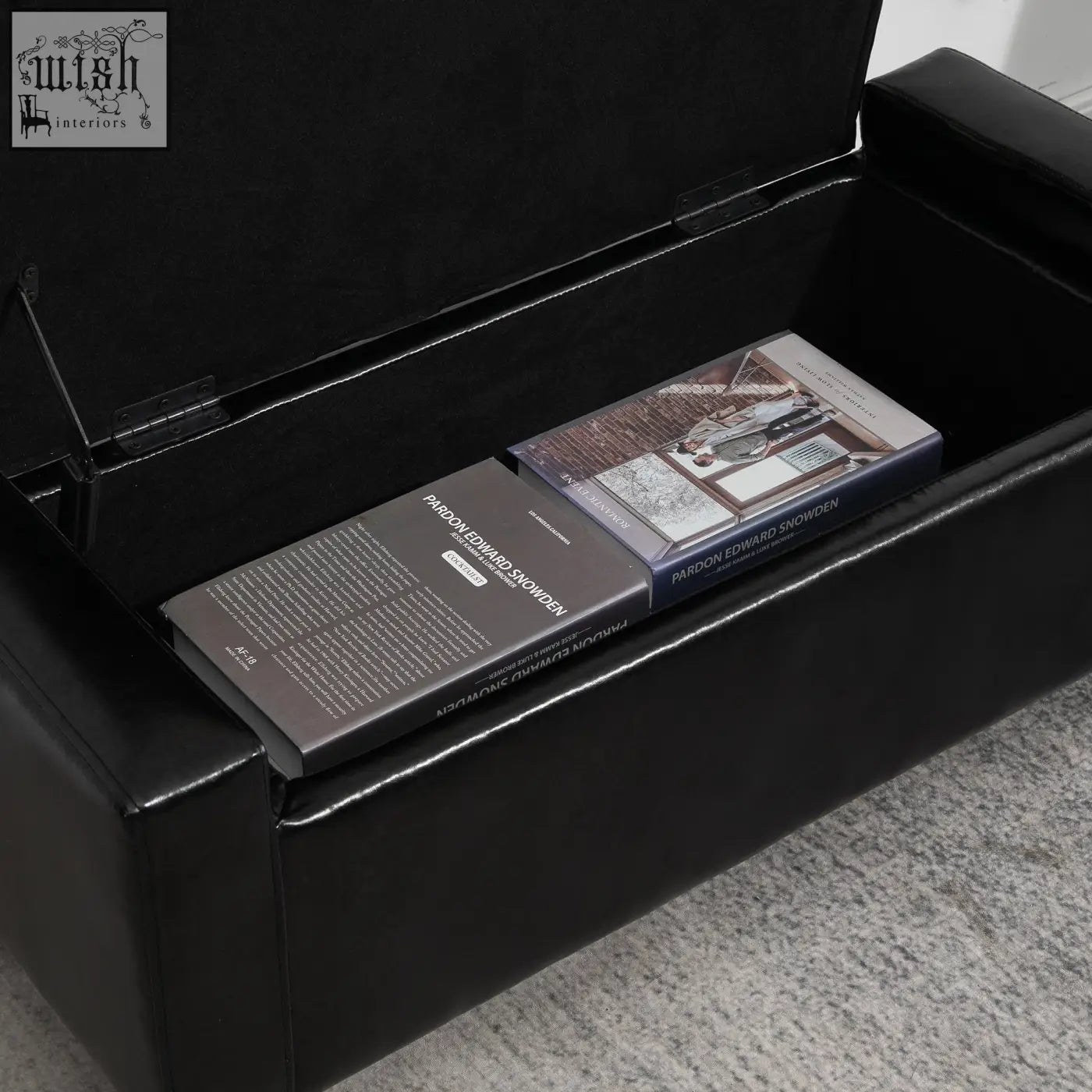 Black HOMCOM storage ottoman with faux leather upholstery, hinged lid, and two books inside for convenient storage