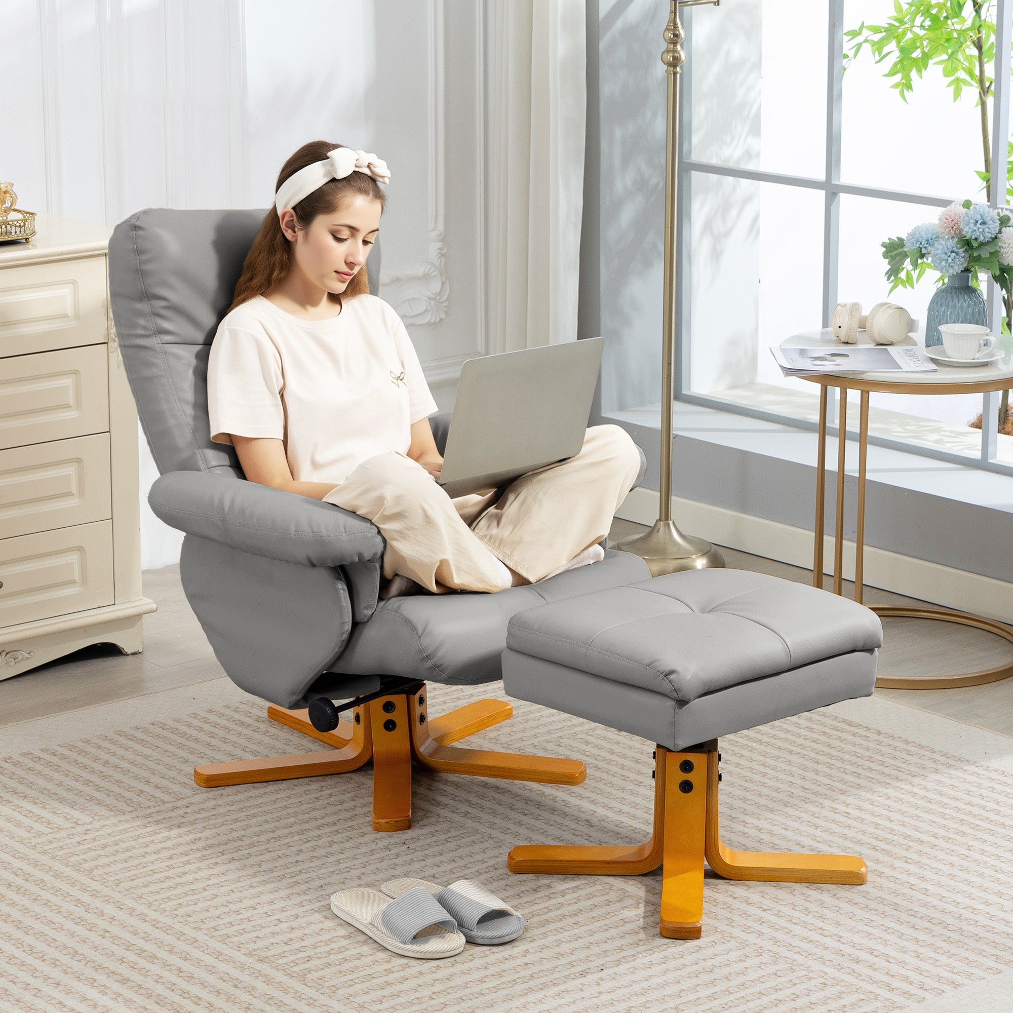 Gray upholstered stylish faux leather recliner chair with wooden base and matching ottoman for living room use
