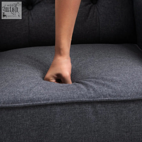 Dark gray tufted fabric cushion with textured weave on homcom recliner armchair for living room comfort