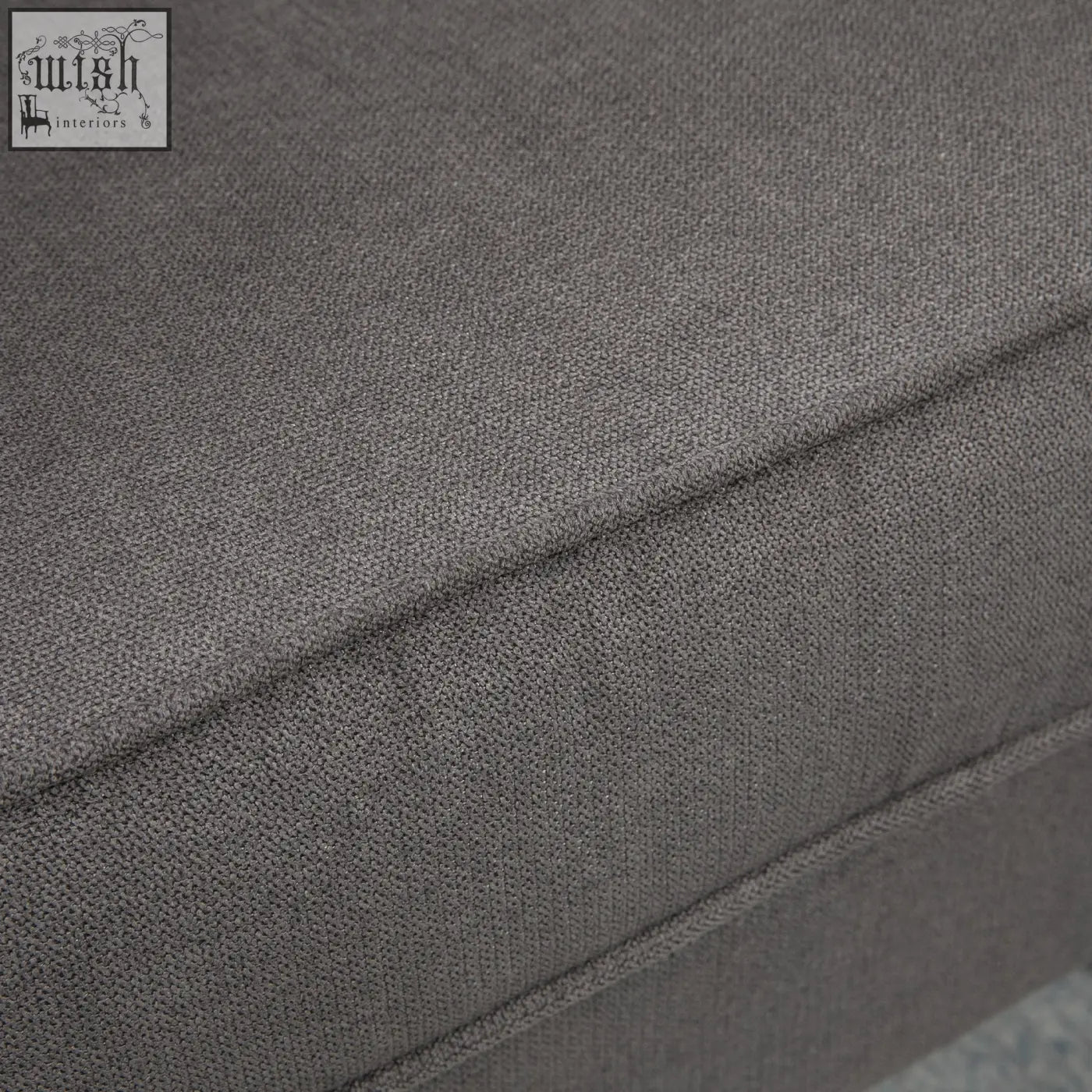 Dark grey textured fabric cushion with visible stitching on the homcom retro accent chair wooden frame