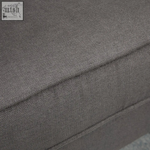 Dark grey textured fabric cushion with visible stitching on the homcom retro accent chair wooden frame