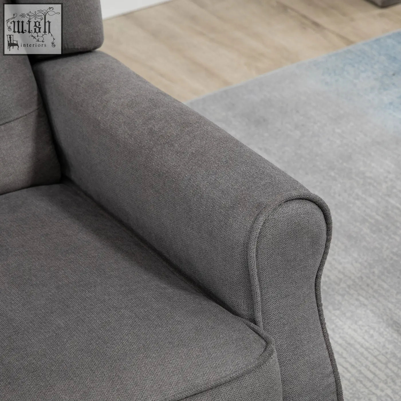 Gray textured accent chair in dark grey with wooden frame and button tufted design for living room or bedroom