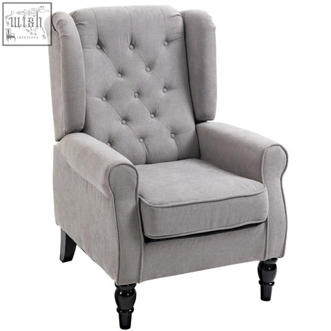 Gray tufted wingback accent chair with button tufted design and black wooden legs perfect as a retro accent chair