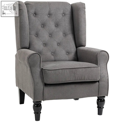 Gray tufted wingback accent chair with black wooden legs in dark grey perfect for floor height living room use