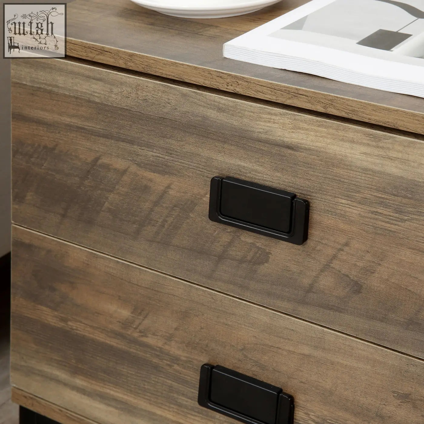 Rustic brown wooden bedside table with two drawers and black metal handles featuring a faded wood effect