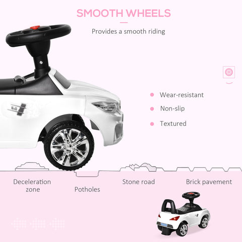 White and black homcom ride on car with chrome wheels steering wheel high backrest and sliding car design for toddlers