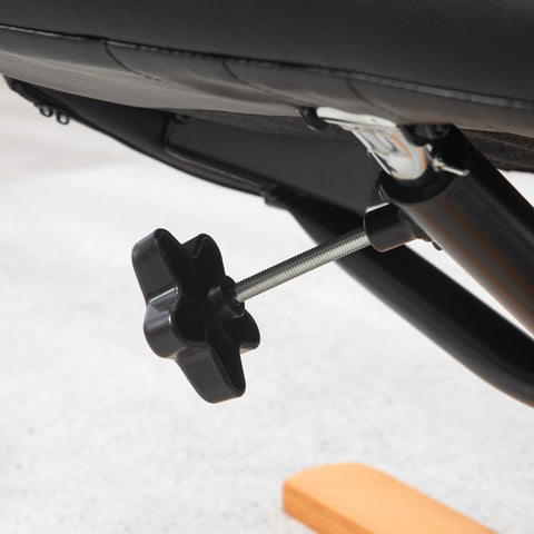 Black star-shaped plastic adjustment knob on metal screw of homcom black pu leather recliner chair for gentle rocking motion