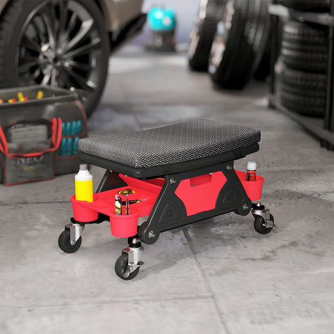 Red and black homcom rolling mechanic stool with textured gray cushion, two storage trays, and rubber casters for garage use