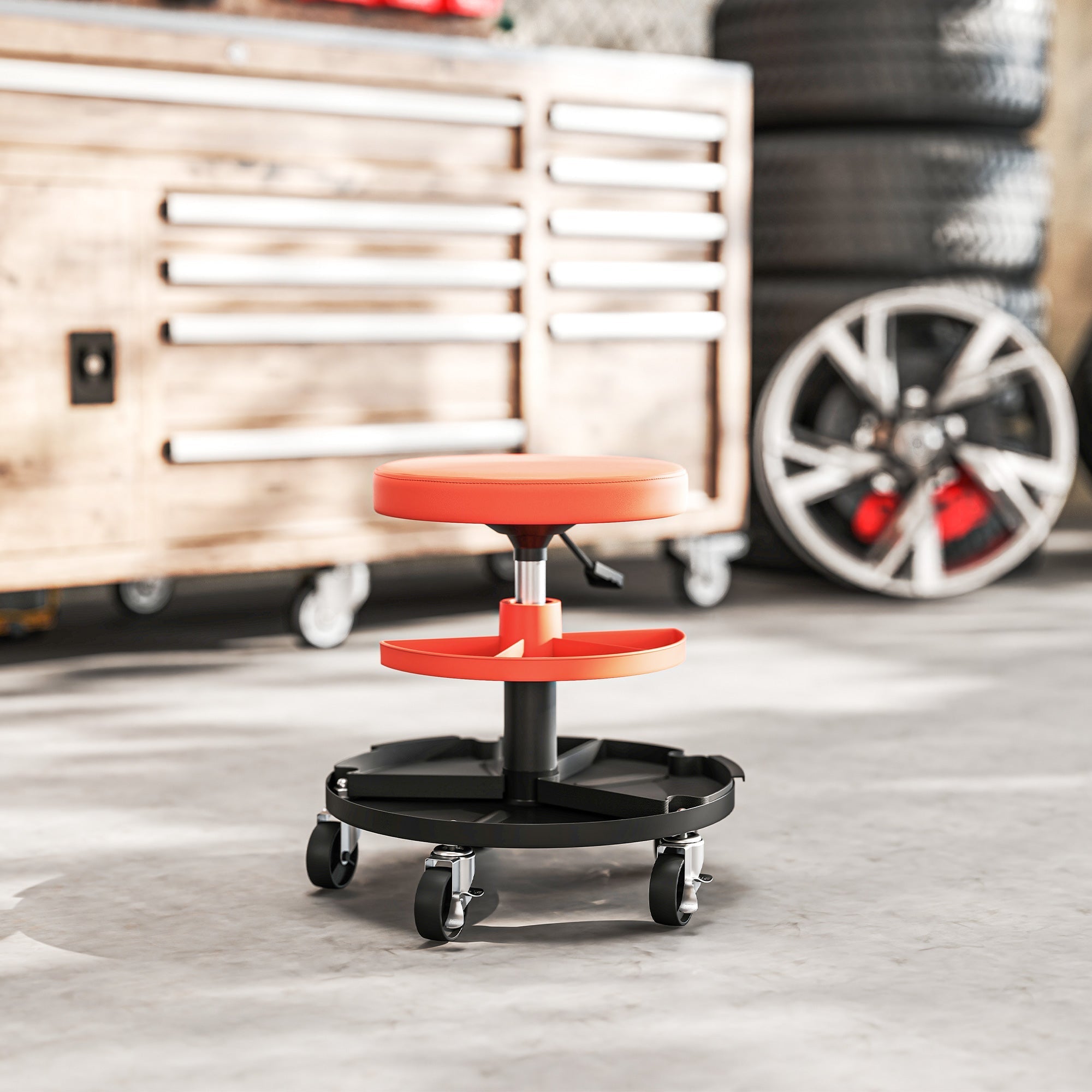 Orange padded workshop stool with black wheeled base and tool tray featuring pneumatic height adjustment by HOMCOM