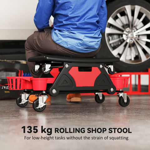 Red and black mechanic stool with concave seat, storage trays, and 360 swivel wheels for garage and shop use