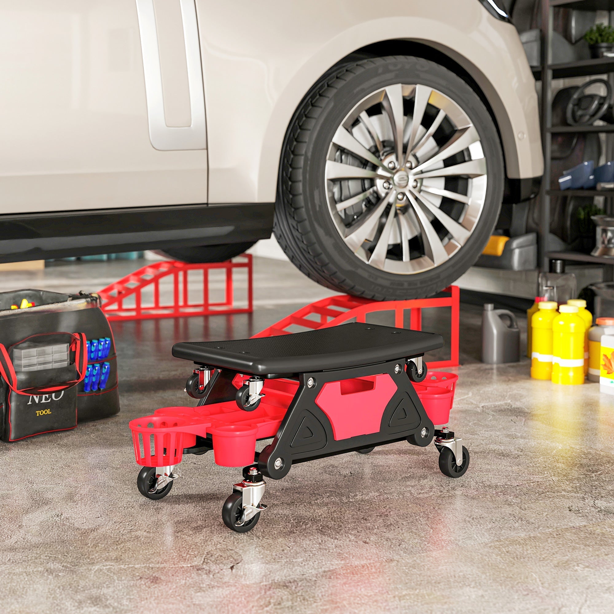 Red and black HOMCOM rolling mechanic stool with concave seat and storage trays for garage and auto repair use