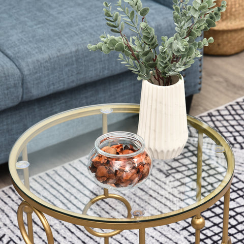 White ribbed ceramic vase with artificial eucalyptus on gold HOMCOM round coffee tables set with tempered glass top