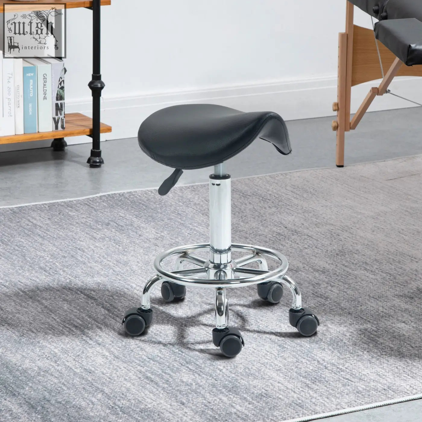 Black leather ergonomic saddle stool with chrome base and casters perfect for salon spa and clinic use