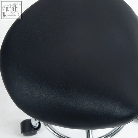 Black homcom saddle stool with padded seat and chrome base ideal for tattoo studios spa and beauty use