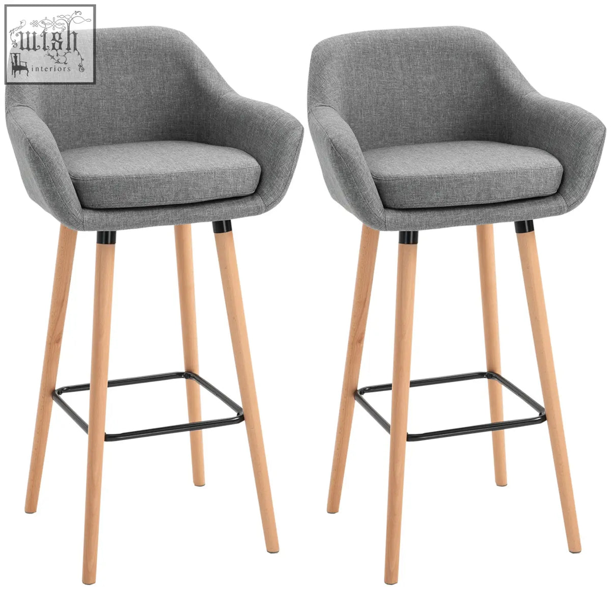 Gray upholstered bar stools with solid wood legs and black metal footrests featuring linen upholstery for dining room use