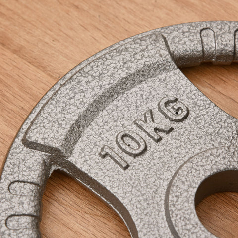 A 10kg speckled gray cast iron weight plate with embossed markings and 2 inch centre hole for dumbbell handle bar
