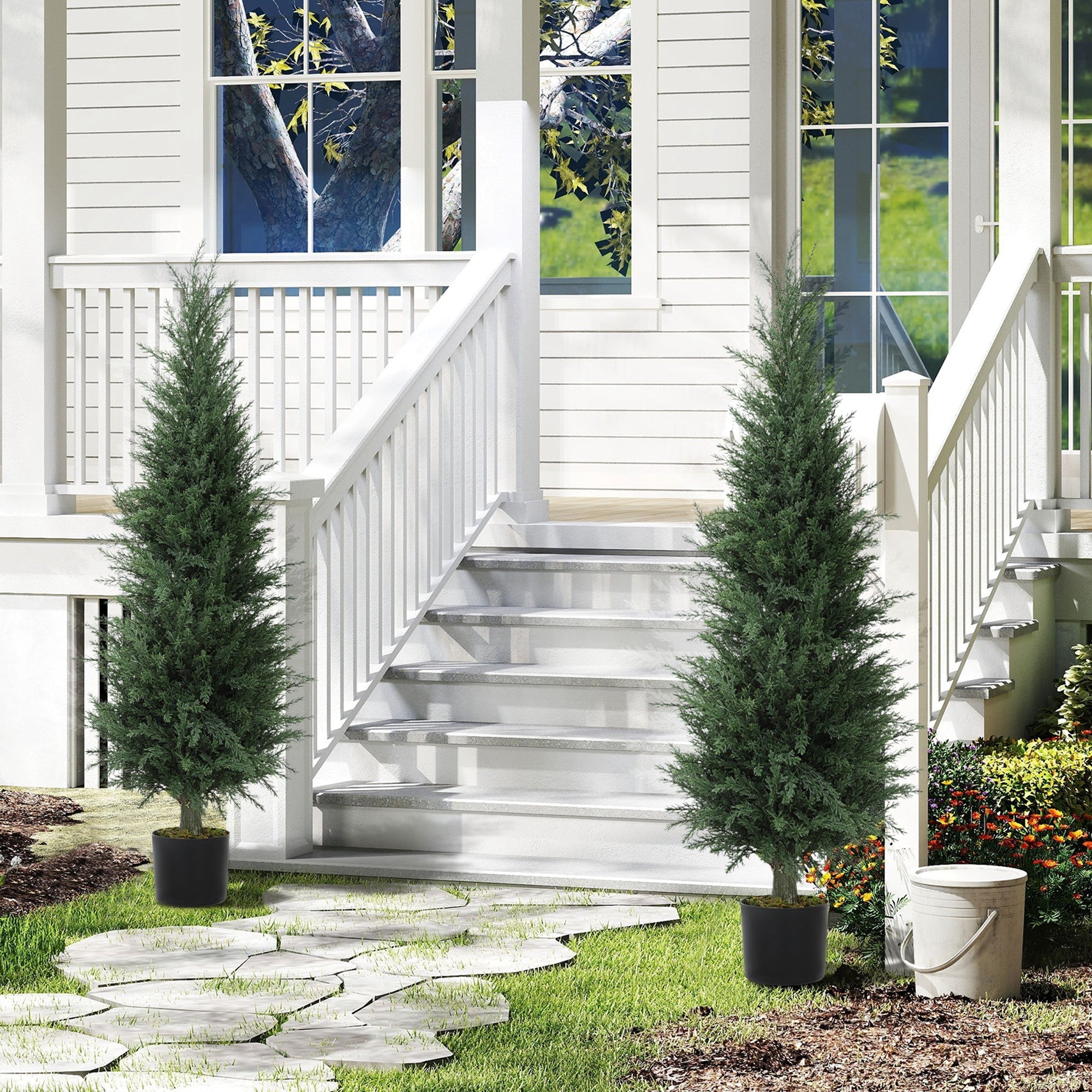 Two tall green cypress artificial plants in black nursery pots flanking white house steps perfect for green thumbs