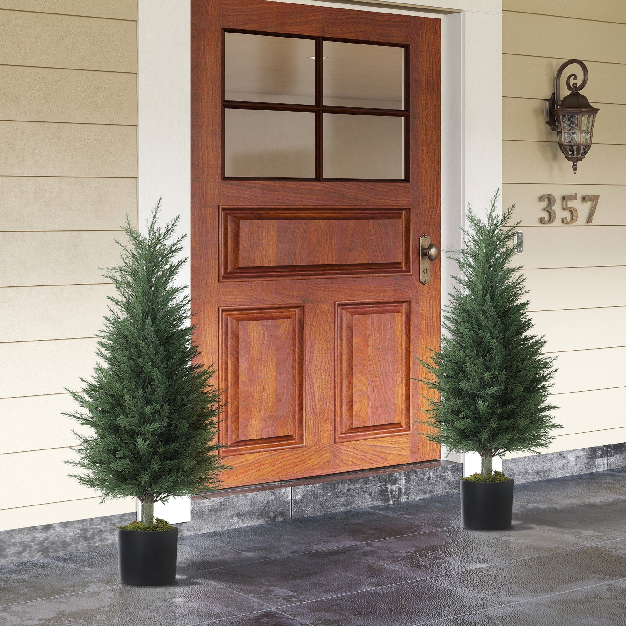 Two identical green thumb artificial cypress trees with dense dark green foliage in sleek black nursery pots