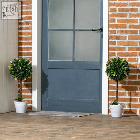 Two low maintenance pink ball-shape tree topiaries with lavender flowers in white ceramic pots for indoor outdoor decor