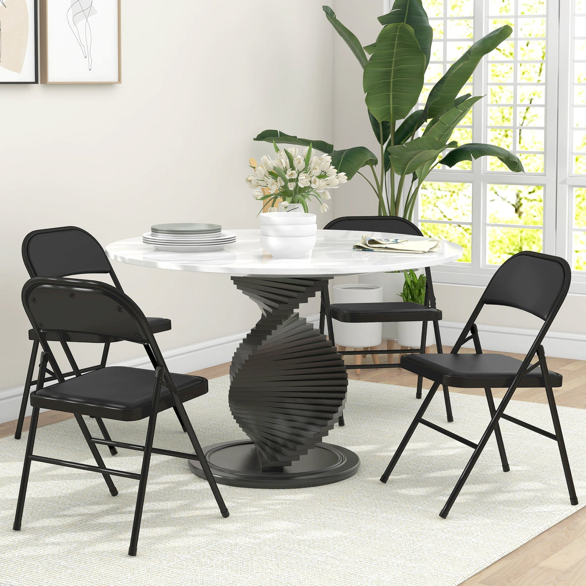 Black metal folding chair with padded seat and backrest featuring sturdy steel frames from HOMCOM set of four folding chairs
