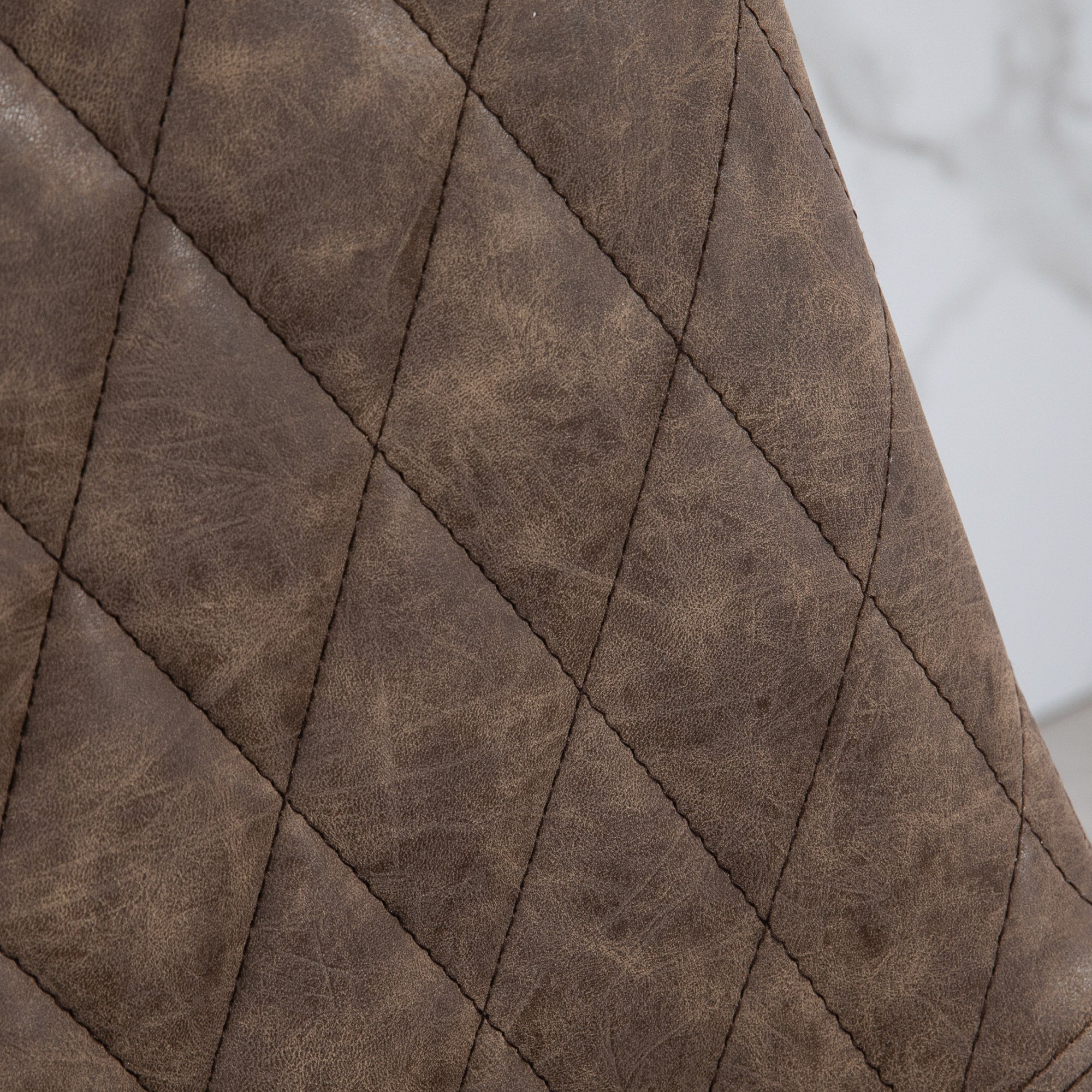 Brown faux leather retro bar stools with diamond quilted faux leather upholstery for stylish seating