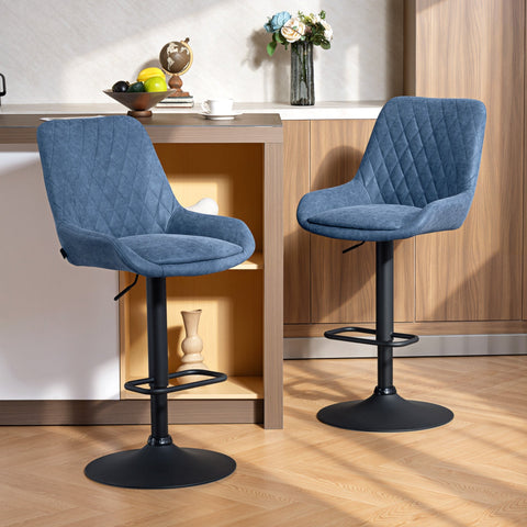Blue quilted velvet bar stools with black metal bases featuring faux leather upholstery for stylish seating