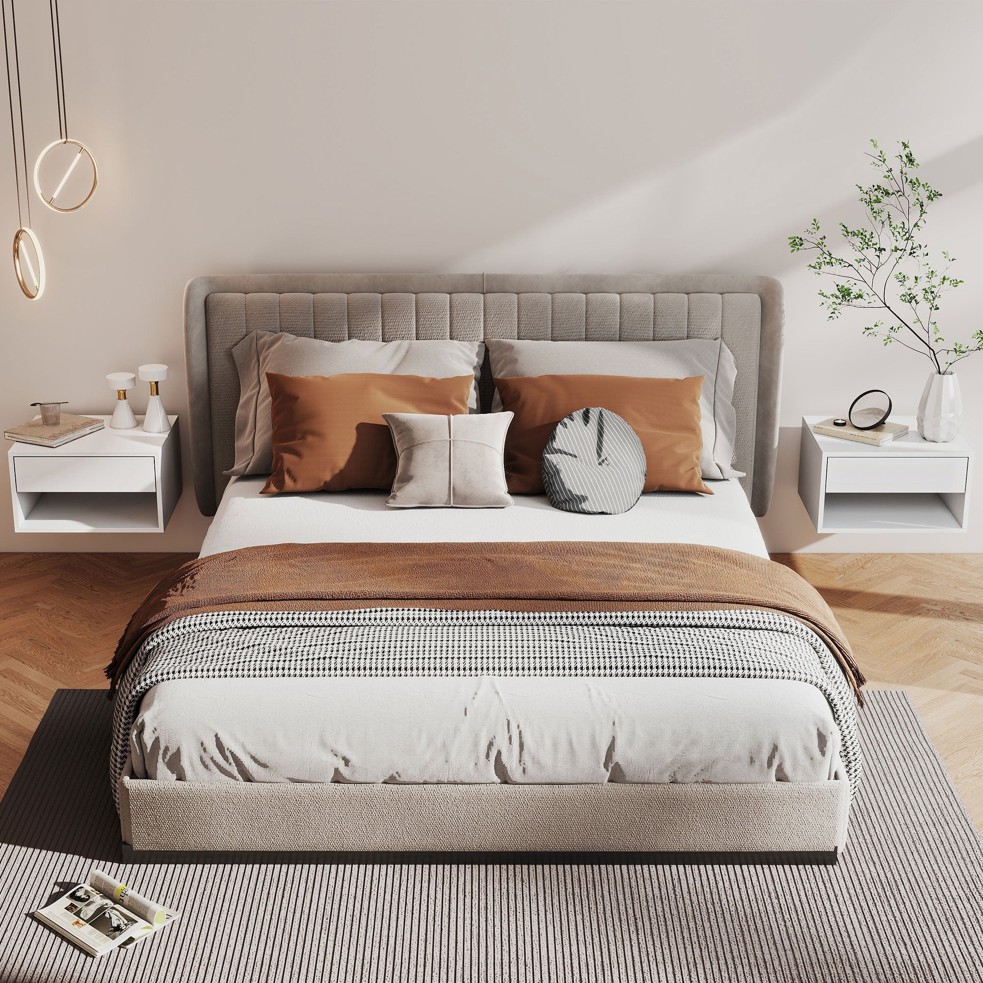 Beige upholstered bed with tufted headboard and footboard layered with white bedding next to white particle board bedside tables with open shelf