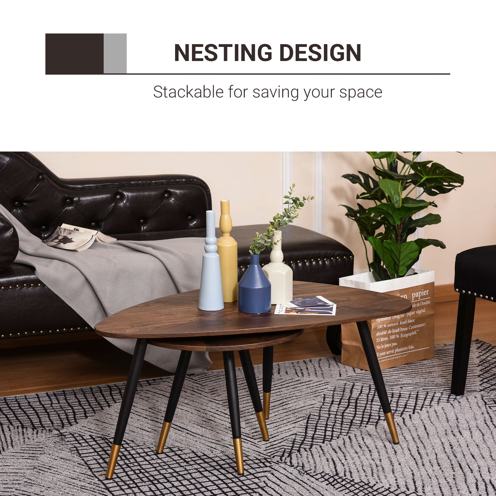 Modern nesting coffee tables set with dark walnut top and black legs with gold accents includes large and small table