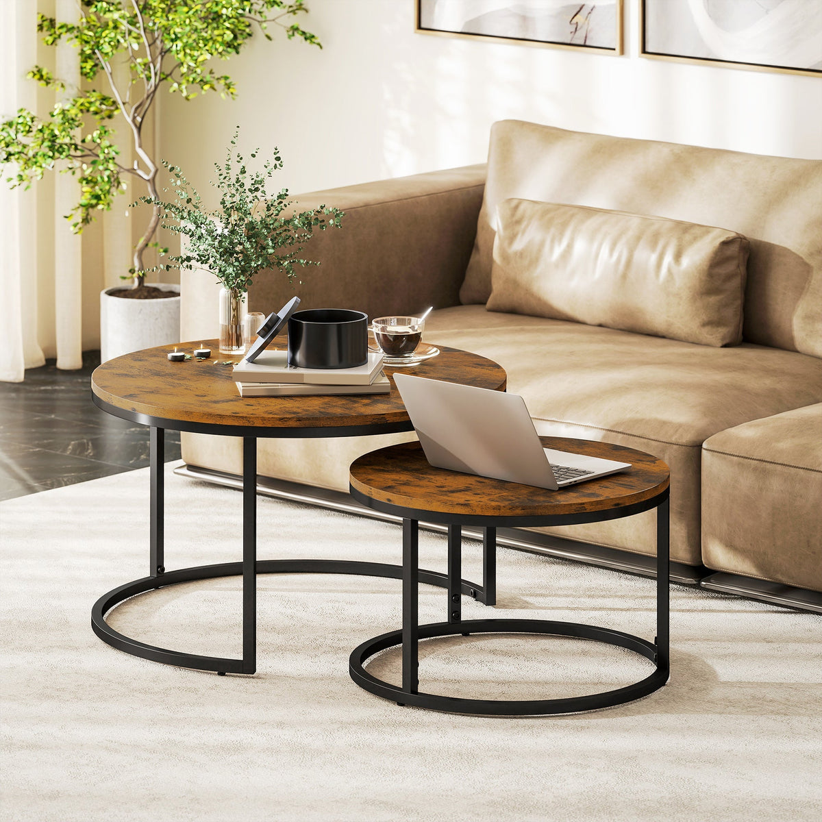 Set of two rustic brown coffee tables with distressed wood table tops and black metal circular bases by HOMCOM