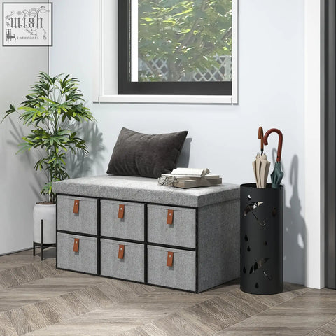 Gray homcom shoe bench with cushioned seat and six fabric drawers holding six shoe pairs for entryway storage