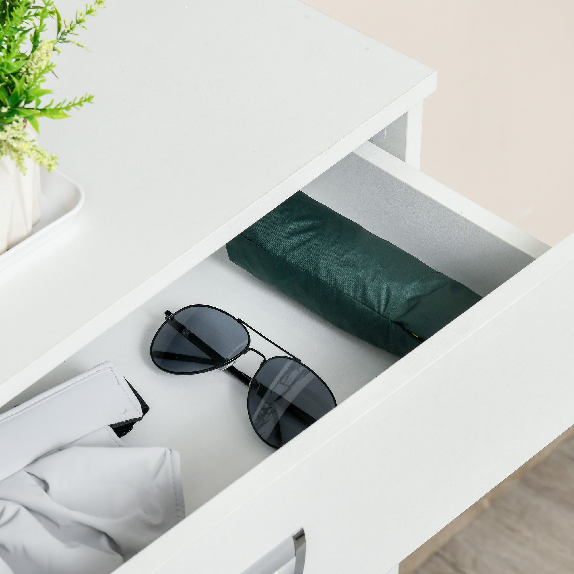 Black aviator sunglasses with sleek metal frame resting in the flip drawer of a white homcom shoe cabinet with large storage