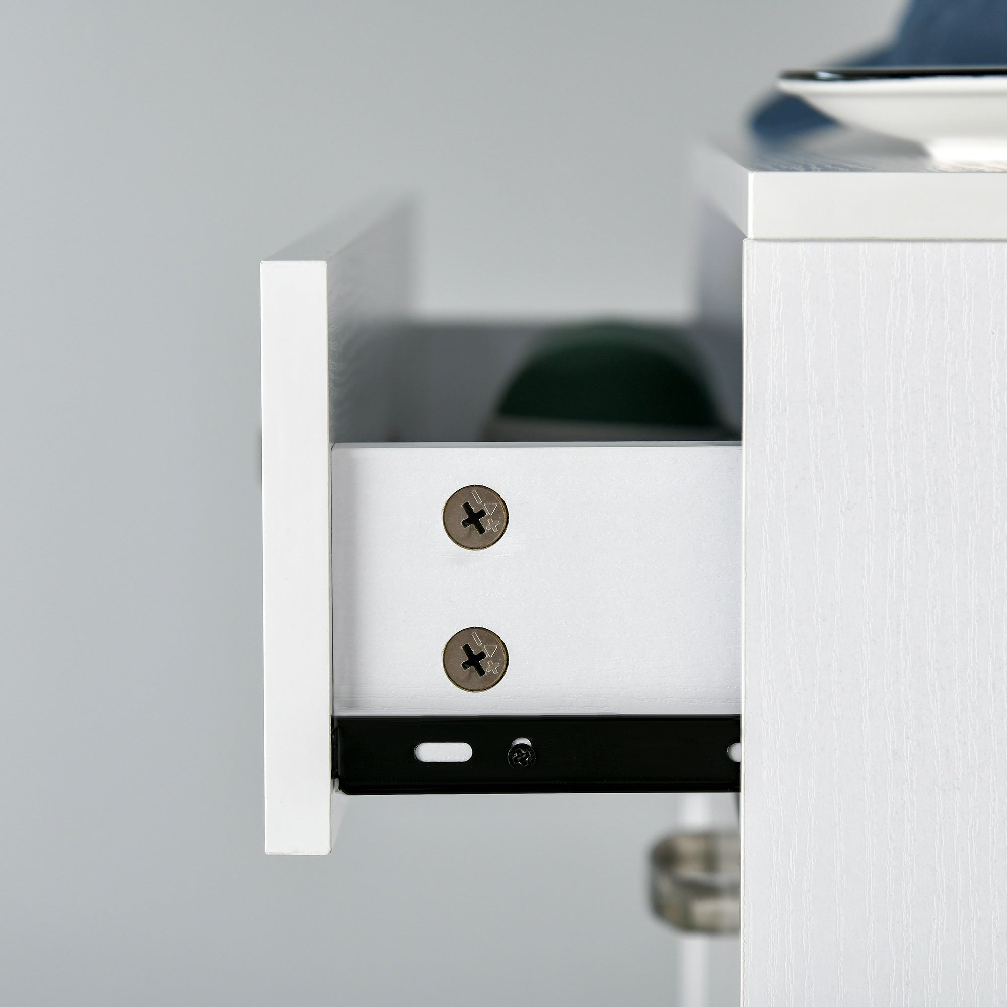 White high gloss shoe cabinet drawer front with silver screws and black metal slide mechanism for flip drawers storage