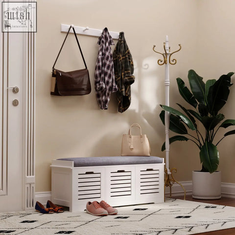 White wooden homcom shoe storage bench with slatted doors and removable gray cushioned seat for hallway organization