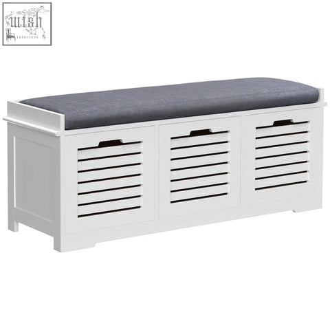 White wooden homcom shoe storage bench with gray cushioned seat and three slatted doors for hallway organization