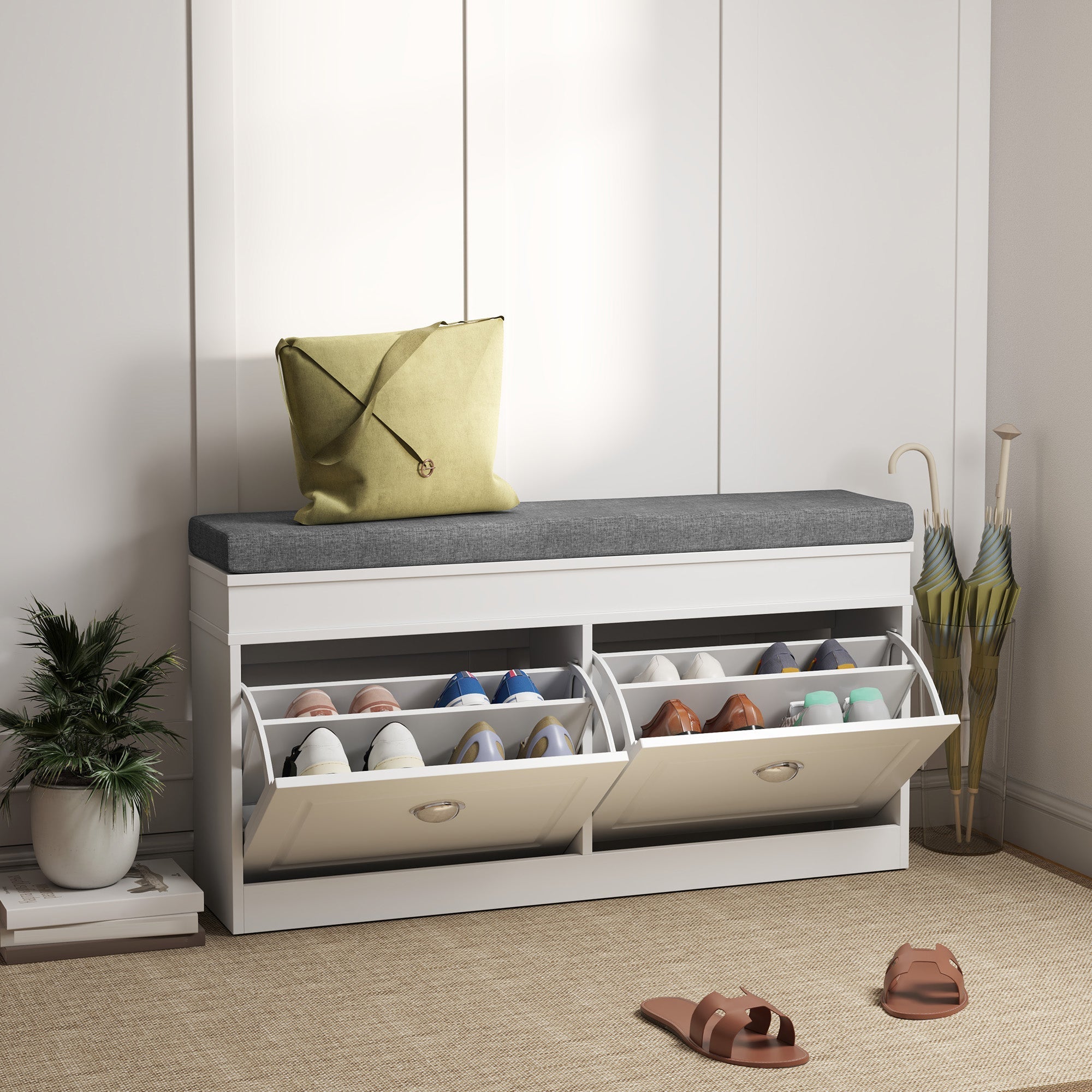 White shoe storage bench with gray upholstered seat and two pull-out drawers made of particle board for shoe storage